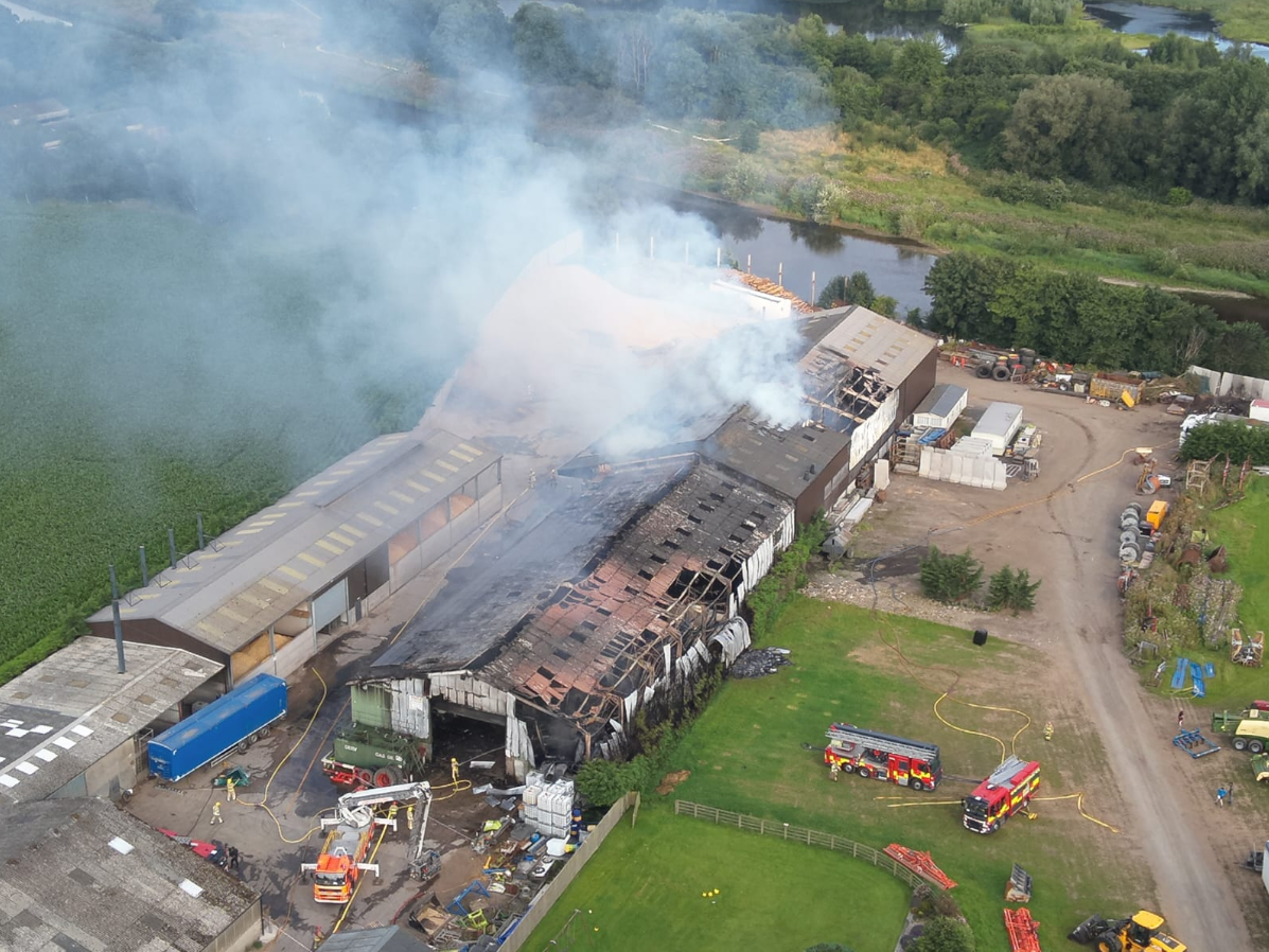 Fire engines still in attendance at farm building fire in Samlesbury
