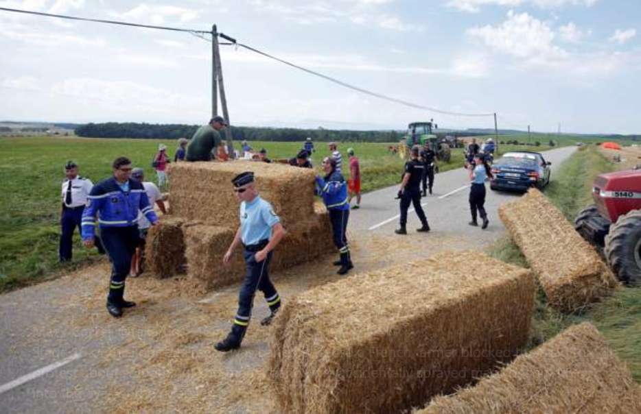 French farmers bring Tour de France to standstill with protest