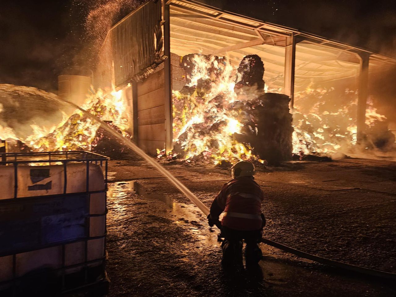 More than 30 firefighters battle blaze involving 300t of straw