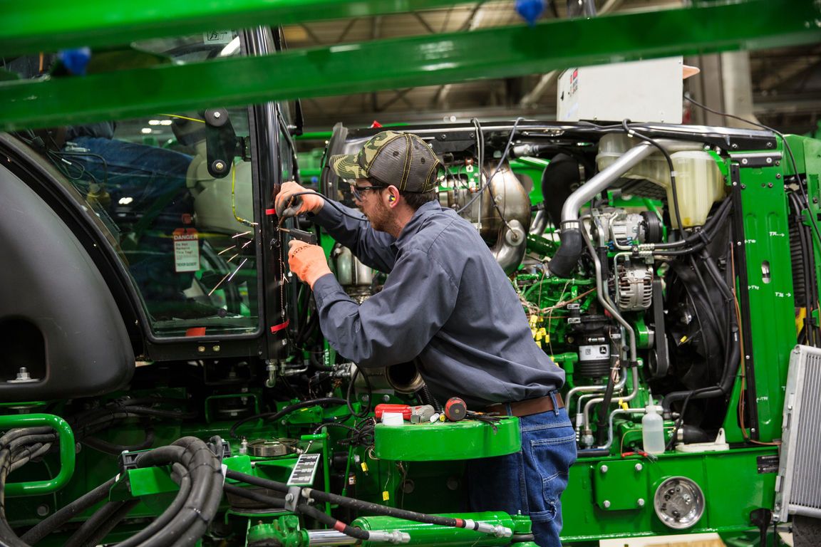 John Deere to cut back production in some factories