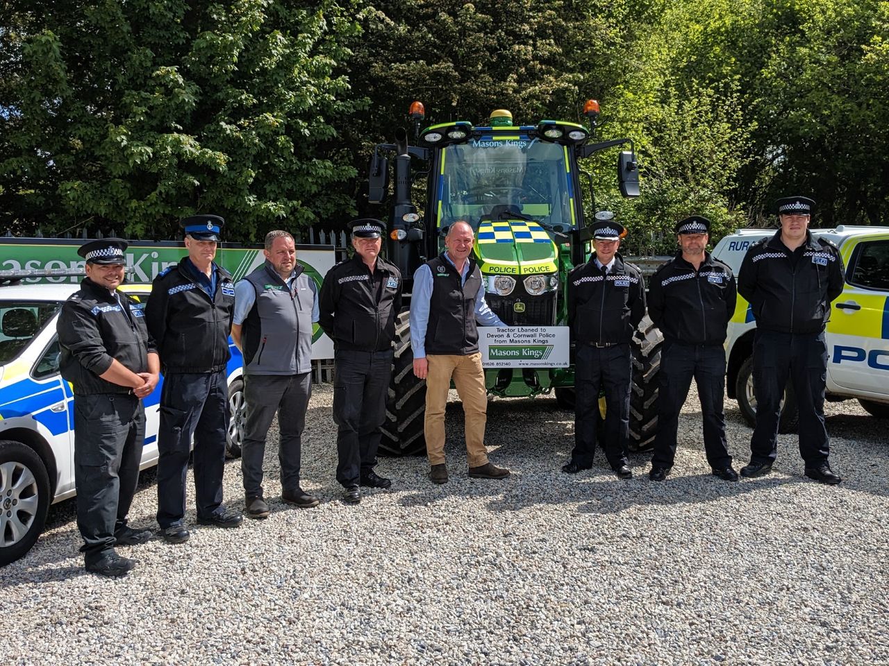 Devon &amp; Cornwall Police receive the tractor from members of Mason Kings
