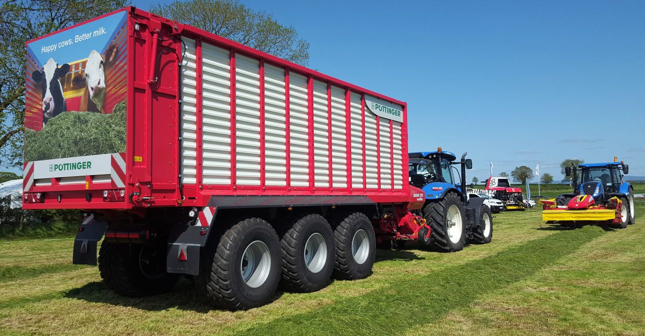 Grass & Muck: 3-axle monster flies flag for wagon fanatics
