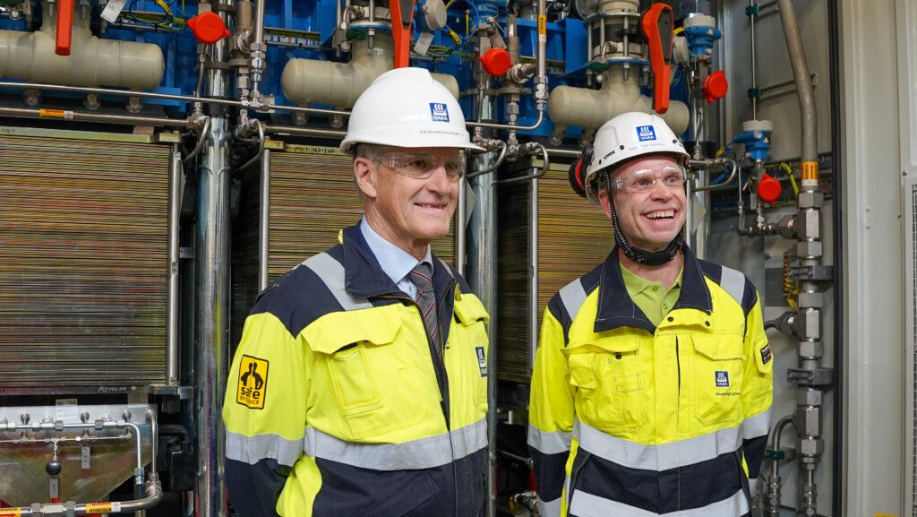 Norwegian Prime Minister Jonas Gahr Store and Yara chief executive Svein Tore Holsether