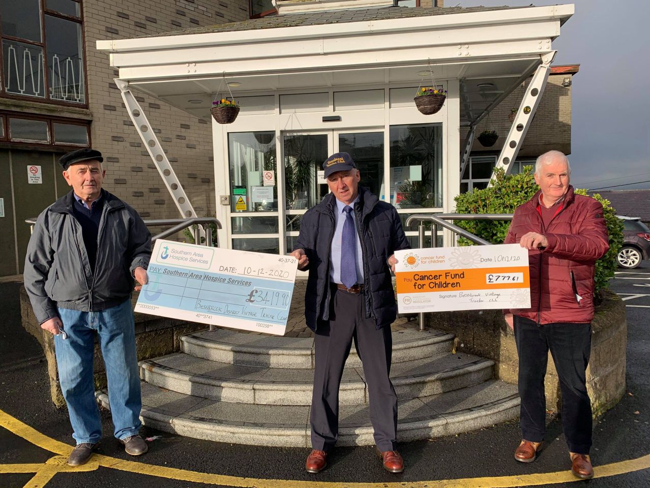 Tractor club delivers Christmas cheer with cheques to charity