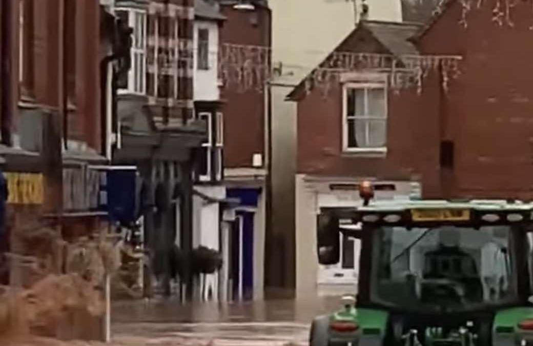 Video of tractor driving through flooded high street leads to arrest